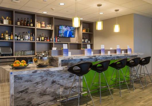 Discover Elevated Travel: Unwind In Luxury At The Club Mco Lounge